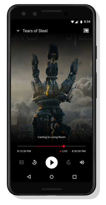 تصویر یک گوشی اندرویدی در حال پخش ویدیو؛ پیام "Casting to Living Room" در پایین، درست بالای مجموعه ای از کنترل های پخش کننده ویدئو ظاهر می شود