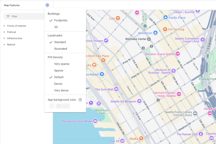 Um mapa do centro de Seattle mostrando ícones padrão de PDIs do Google: um pequeno ícone branco em um glifo de ícone azul-petróleo em forma de gota sobre pontos turísticos como o Museu de Arte e a Smith Tower.