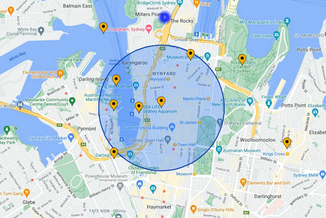 Una mappa con indicatori gialli e un cerchio blu semitrasparente sovrapposto.