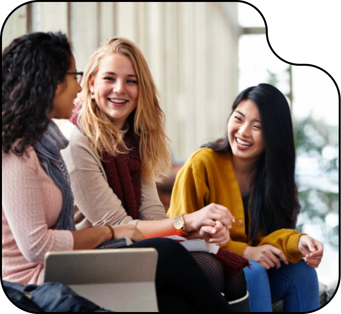 Image of three women working together in a peer group.